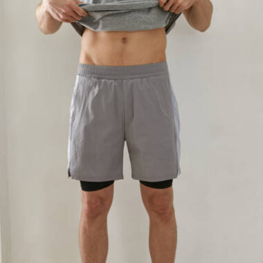 A male model in tracksuit shorts